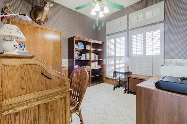 home office featuring ceiling fan and light colored carpet