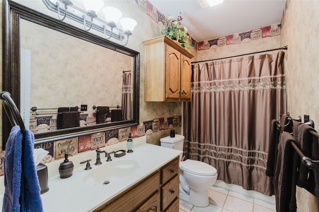 bathroom with tile patterned floors, toilet, vanity, and a shower with curtain