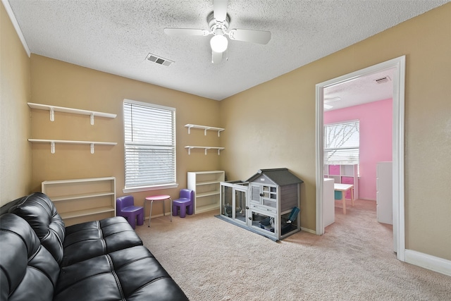 728 Oriole Dr, Saginaw, TX 76131 - game room with a textured ceiling, light colored carpet, a ceiling fan, baseboards, and visible vents