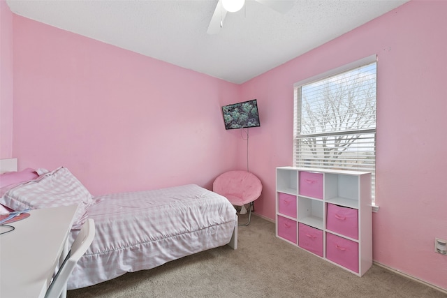728 Oriole Dr, Saginaw, TX 76131 - bedroom with carpet floors, a textured ceiling, and a ceiling fan