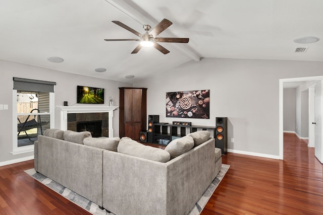 living area with lofted ceiling with beams, a fireplace, visible vents, baseboards, and dark wood finished floors