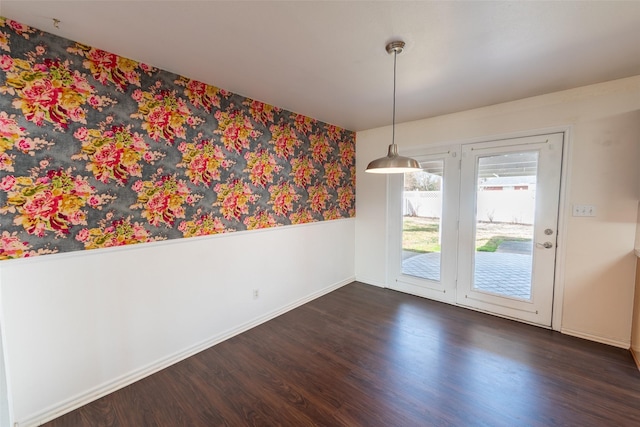 unfurnished dining area with dark hardwood / wood-style flooring