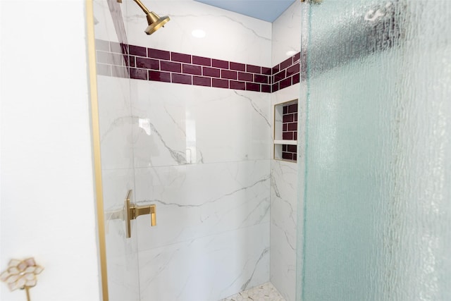 bathroom with tiled shower