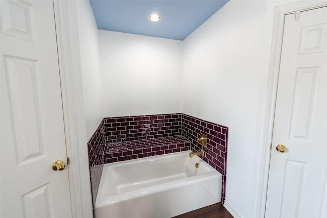 bathroom with a tub to relax in