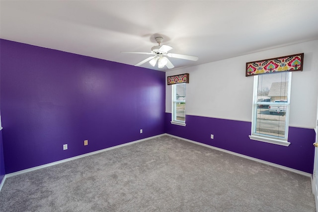 carpeted empty room with ceiling fan