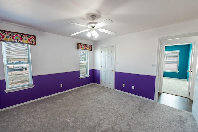 carpeted empty room with ceiling fan