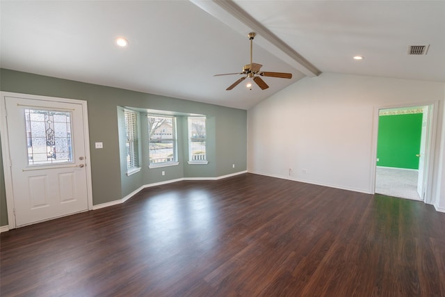 interior space featuring lofted ceiling with beams, a healthy amount of sunlight, dark wood-type flooring, and ceiling fan