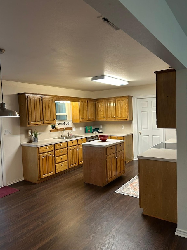 604 Mustang, Mount Vernon, TX 75457 - kitchen featuring light countertops, brown cabinets, and dark wood-style flooring