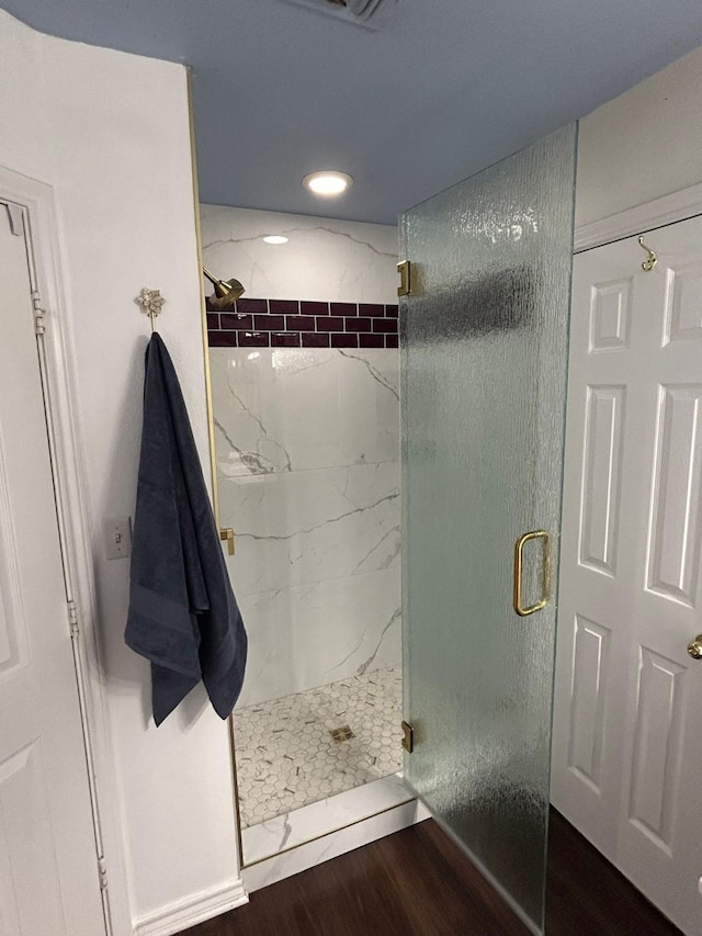 604 Mustang, Mount Vernon, TX 75457 - bathroom with a marble finish shower, wood finished floors, and recessed lighting