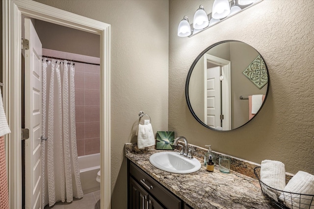 full bathroom with tile patterned flooring, vanity, shower / bath combination with curtain, and toilet