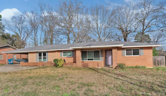 single story home with a carport, a patio area, and a front yard