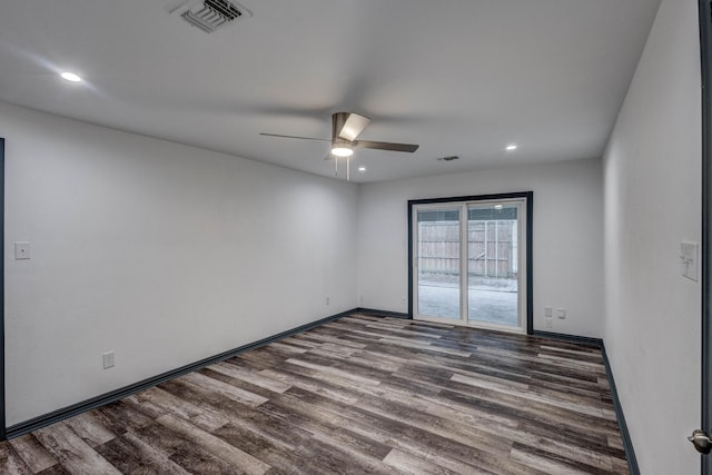 spare room with ceiling fan and hardwood / wood-style floors