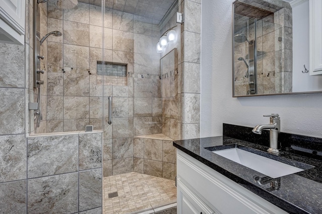 bathroom with vanity and an enclosed shower