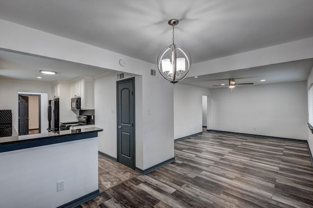 kitchen with black appliances, white cabinetry, dark hardwood / wood-style flooring, hanging light fixtures, and kitchen peninsula