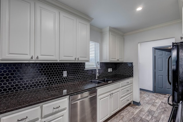 kitchen with sink, crown molding, dishwasher, white cabinetry, and dark stone counters