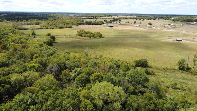 birds eye view of property featuring a rural view