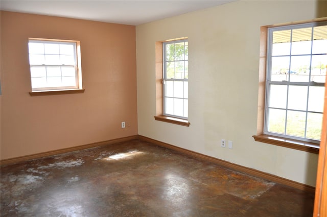 spare room with concrete floors