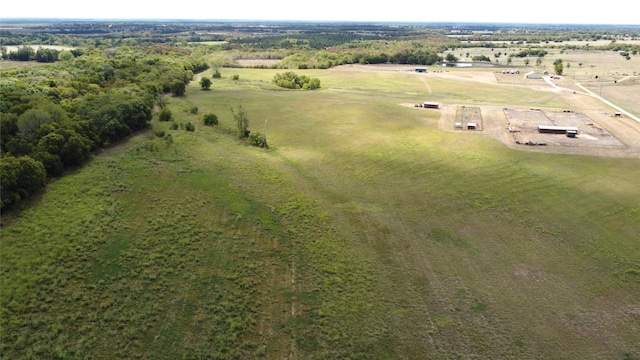 birds eye view of property with a rural view