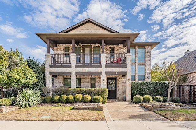 view of front of property with a balcony