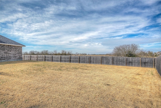 view of yard featuring a fenced backyard