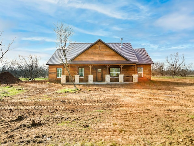 rear view of house with a porch