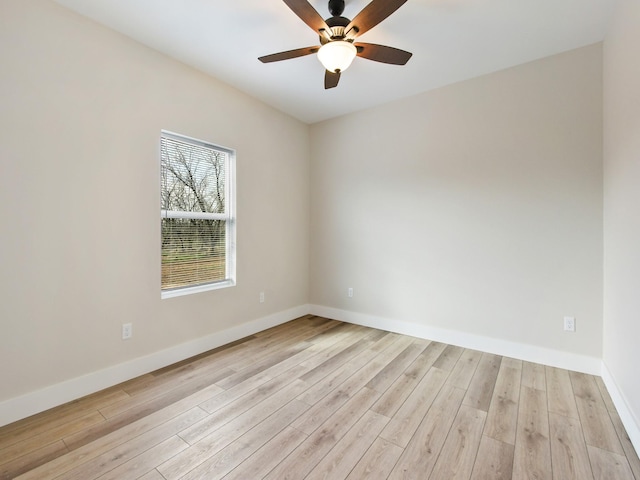 empty room with light hardwood / wood-style flooring and ceiling fan