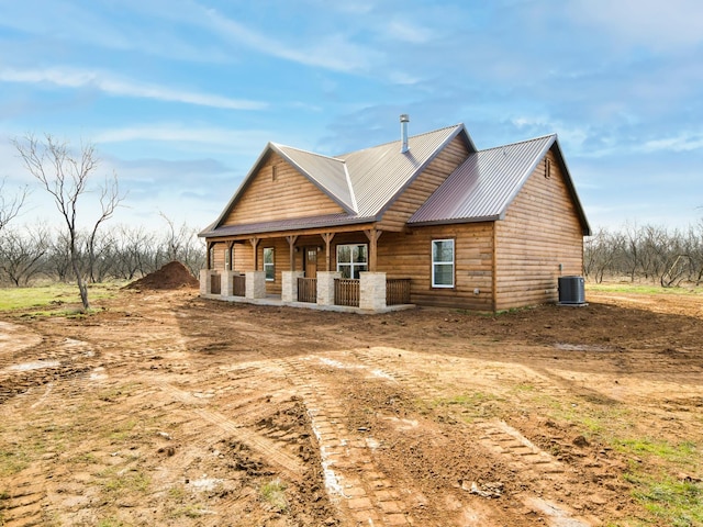 view of front of property with central AC unit and a porch