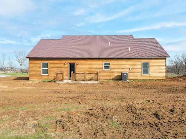 back of house featuring central air condition unit