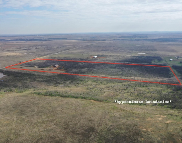 birds eye view of property with a rural view