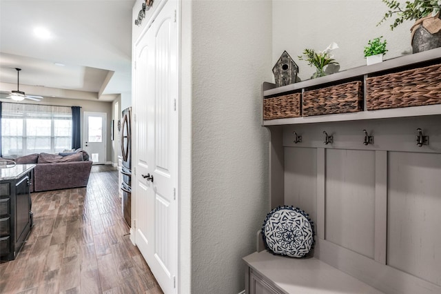 mudroom with hardwood / wood-style floors and ceiling fan