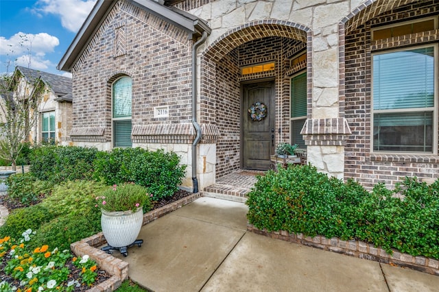 property entrance featuring a patio area