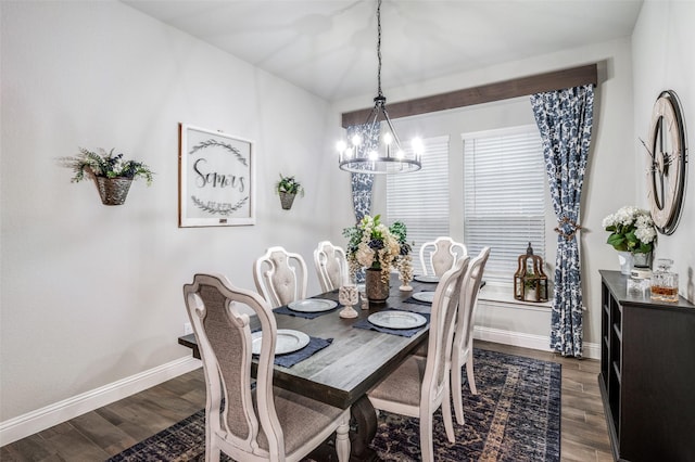 dining area with an inviting chandelier and dark hardwood / wood-style flooring