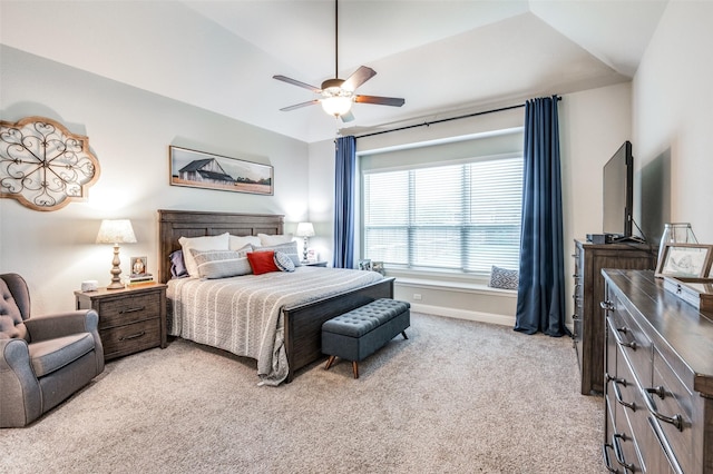 carpeted bedroom featuring vaulted ceiling and ceiling fan