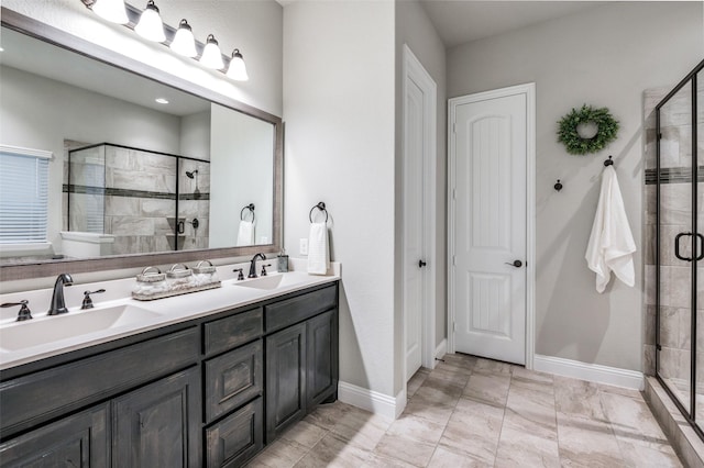 bathroom featuring vanity and an enclosed shower