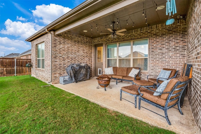 view of patio / terrace featuring a grill, an outdoor living space with a fire pit, and ceiling fan