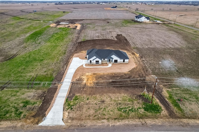 birds eye view of property featuring a rural view