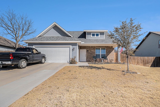 view of front of house featuring a garage, concrete driveway, roof with shingles, fence, and brick siding