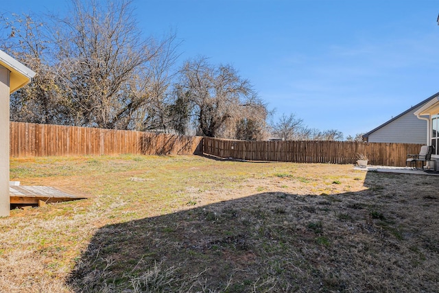 view of yard with a fenced backyard