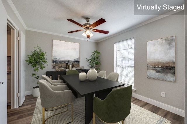 dining space featuring ornamental molding, dark hardwood / wood-style floors, and ceiling fan