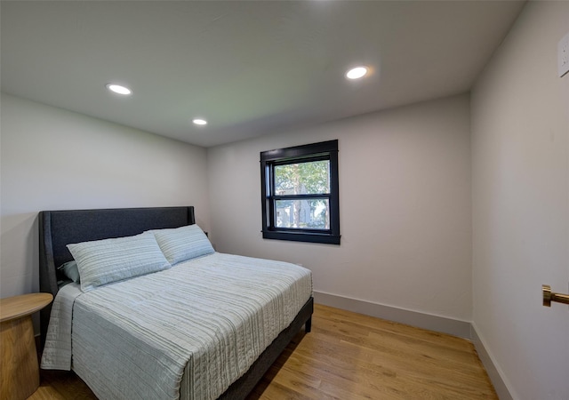 bedroom with light hardwood / wood-style flooring