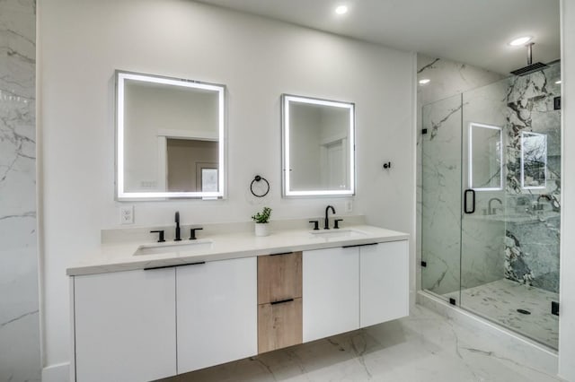 bathroom featuring vanity and a shower with door