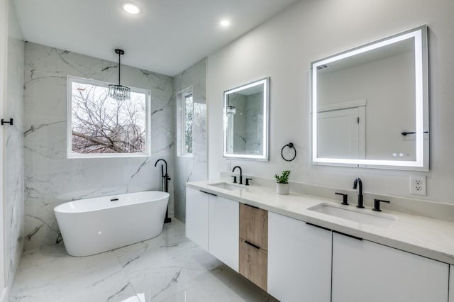 bathroom with vanity and a bathing tub