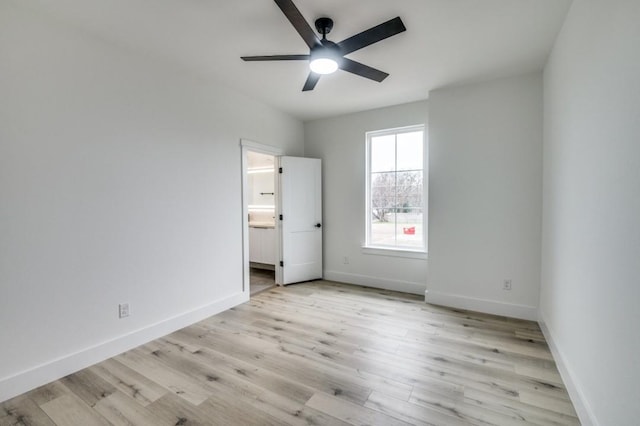 unfurnished bedroom with connected bathroom, ceiling fan, and light hardwood / wood-style flooring