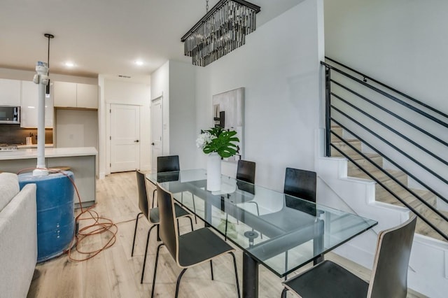 dining area featuring light wood-type flooring