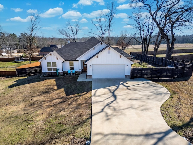 modern farmhouse with a garage and a front yard