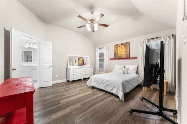 bedroom featuring ceiling fan, lofted ceiling, dark hardwood / wood-style flooring, and connected bathroom