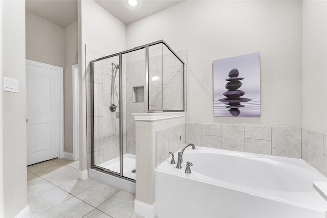 bathroom with plus walk in shower and tile patterned floors