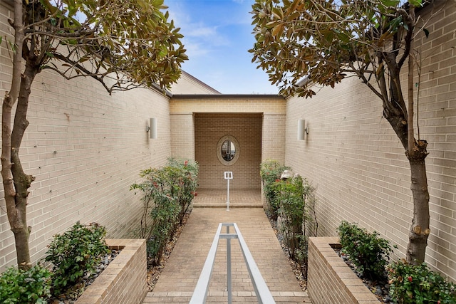 property entrance with brick siding