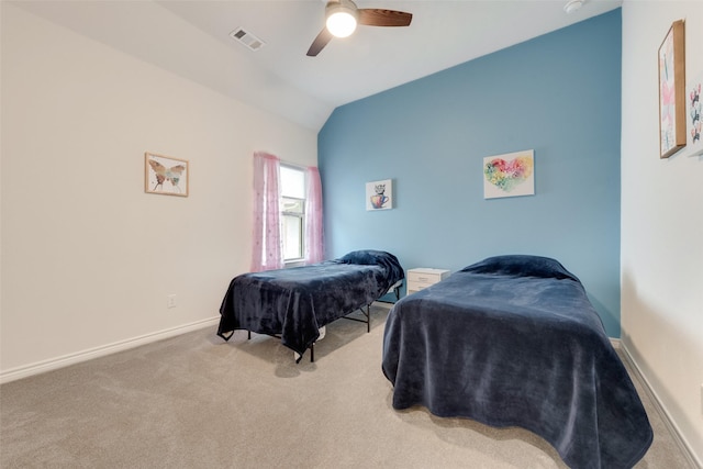 carpeted bedroom featuring lofted ceiling and ceiling fan