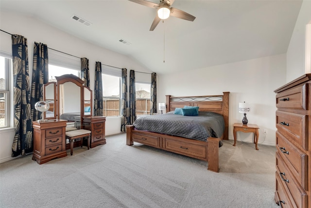 carpeted bedroom with lofted ceiling, multiple windows, and ceiling fan